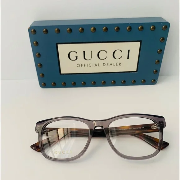 Gucci's GG0004ON features soft lines frames acetate front. Iconic web effect